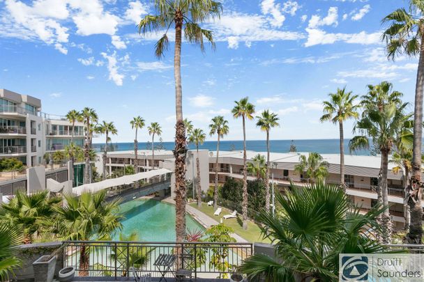 BEACHSIDE APARTMENT IN HIGHLY SOUGHT AFTER COMPLEX - Photo 1