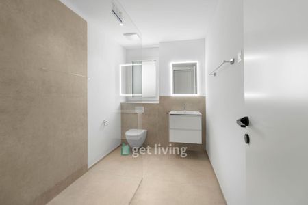 NEUBAU AN TOPLAGE MIT GROSSZÜGIGEM SITZPLATZ (40 M²) SOWIE EIGENER WASCHKÜCHE UND KELLER (17,4 M²). THE APARTMENT CAN ALSO BE RENTED FURNISHED IF DESIRED. - Foto 2