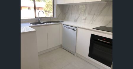 Stylish Renovated Three-Bedroom Townhouse - Photo 2