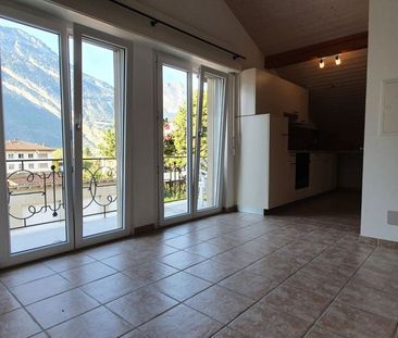 2.0 pces avec balcon et place de parc au centre du village - Photo 1