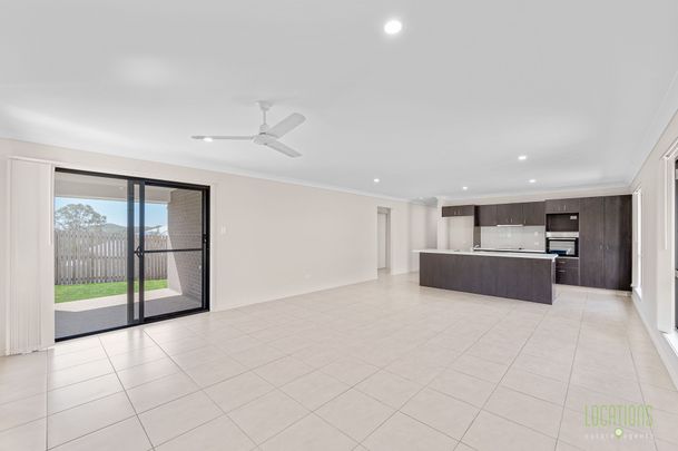 Stylish, Spacious, and Set to Impress - Welcome to 28 Liriope Drive! - Photo 1
