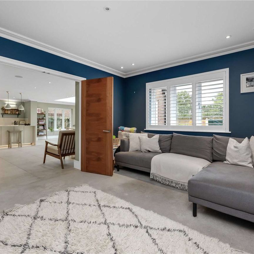 A superb seven bedroom family home situated in a popular residential road just 0.7 of a mile from Oxshott station. - Photo 1