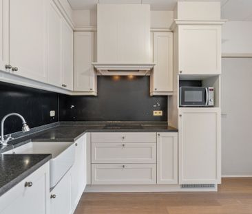 Gelijkvloers appartement met 1 à 2 slaapkamers, tuintje en garagebox - Photo 3