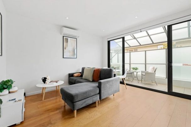 Stylish First-Floor Apartment with Sun-Filled Living - Photo 1