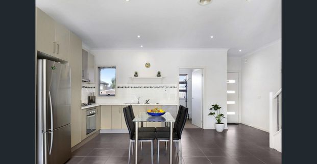 Elegant Double-Storey Townhouse Offering Modern Comfort and Low-Maintenance Living - Photo 1