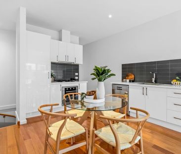 Spacious Two-Bedroom Design with Private Bathrooms - Photo 1