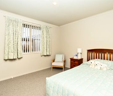 This spacious three-bedroom, two-bathroom property is nestled in th... - Photo 2