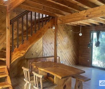 Cosy Coastal Cabin Living - Photo 1