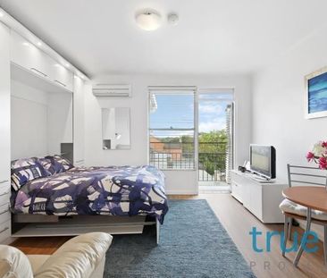 FULLY FURNISHED AND PERFECTLY LOCATED TOP FLOOR STUDIO APARTMENT - Photo 1