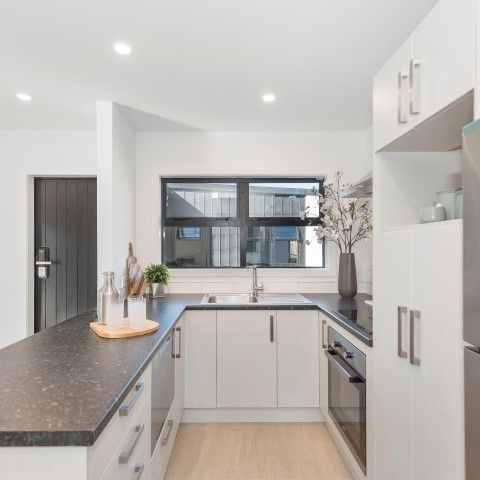 Located on Bruce Avenue, this modern two-bedroom unit offers comfortable, low-maintenance living in a fully secure setting with an automatic gate. - Photo 1