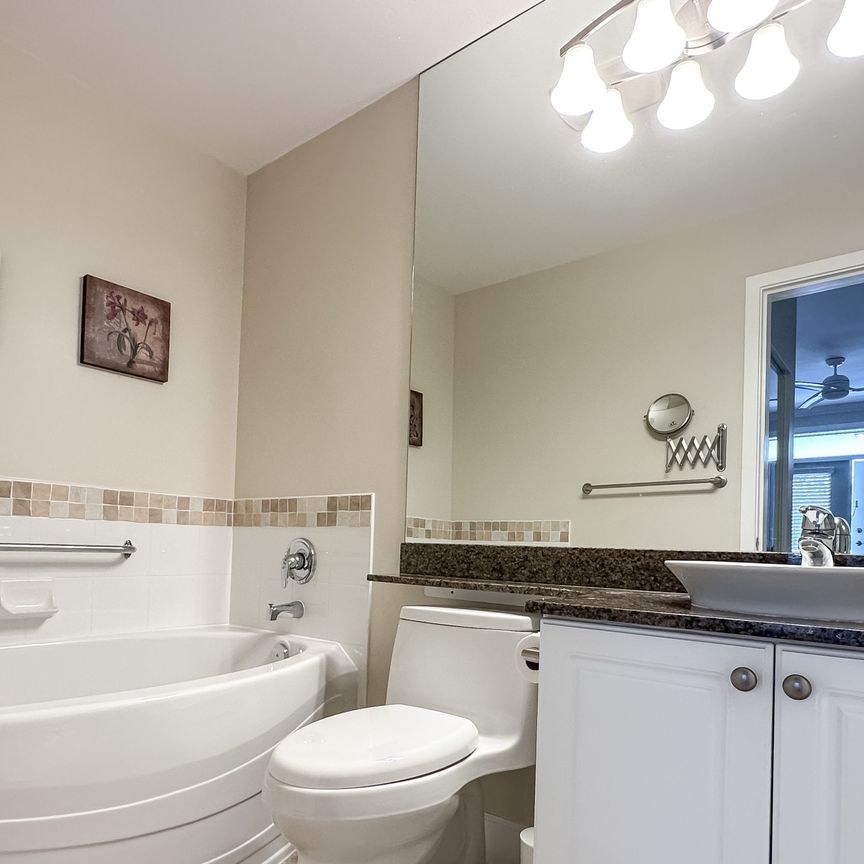 2 Bed + Den Condo | Steveston Village | Pond View • Parking - Photo 1