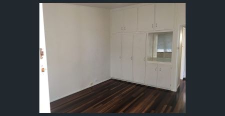 Charming Two-Bedroom Unit with Private Courtyard in the Heart of Coorparoo - Photo 2