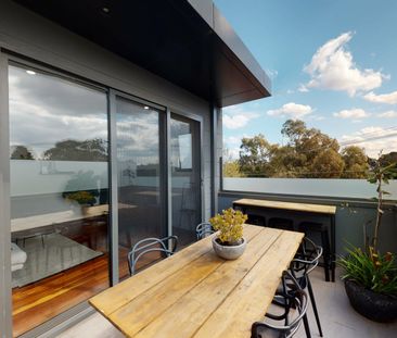 Stunning Townhouse with Modern Comfort and Light-Filled Living - Photo 1