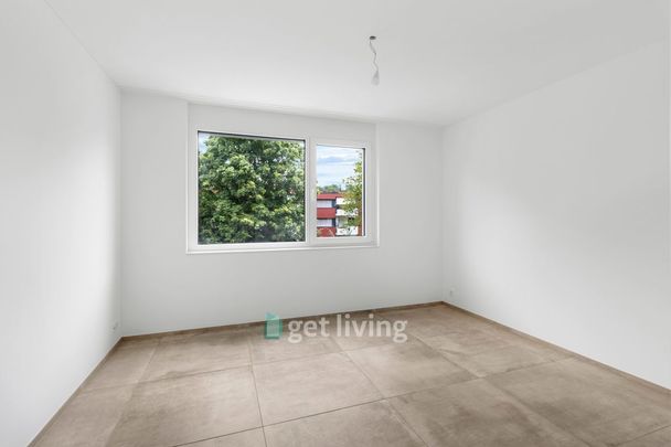 NEUBAU AN TOPLAGE MIT GROSSZÜGIGEM SITZPLATZ (40 M²) SOWIE EIGENER WASCHKÜCHE UND KELLER (17,4 M²). THE APARTMENT CAN ALSO BE RENTED FURNISHED IF DESIRED. - Foto 1