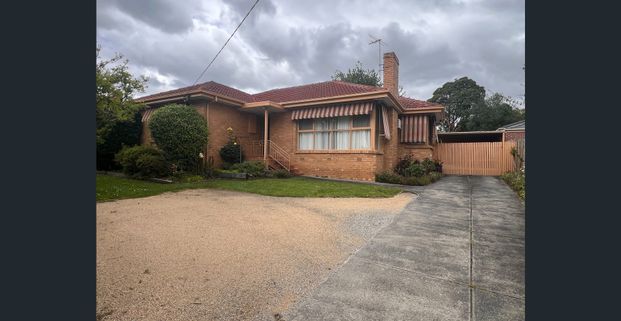 Comfortable Three-Bedroom Home in a Convenient Location - Photo 1