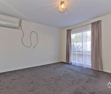 Conveniently located two-bedroom unit - Photo 2