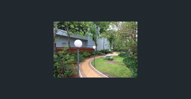 "WHAT A GEM"....IMMACULATELY RENOVATED, THIS RESORT STYLE MOD. 2 BED, 2 BATH AND LOCK-UP GARAGE APARTMENT. - Photo 1