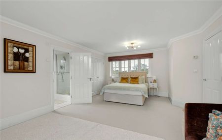 Set within a prestigious private estate, this impressive six bedroom residence offers generous and versatile accommodation perfectly designed for modern family living. - Photo 3