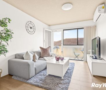 Renovated top-floor unit positioned at the rear of the complex, wal... - Photo 2