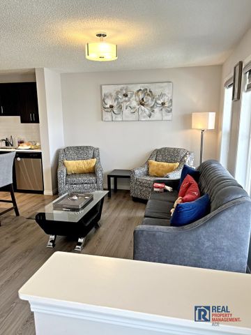10799 Cityscape Drive NE | Townhouse | 3-bedroom, 2.5-bathroom | Double Garage - Photo 2