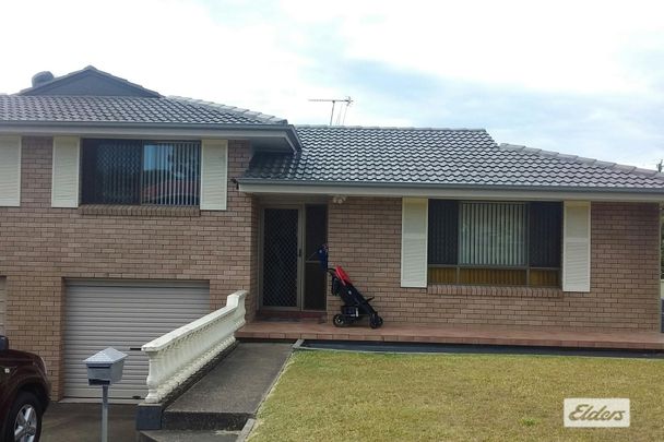 Charming 3 Bedroom Brick Home with Double Garage - Photo 1