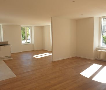 Appartement de 3,5 pièces au 1er étage avec parcelle de jardin privé - Photo 1