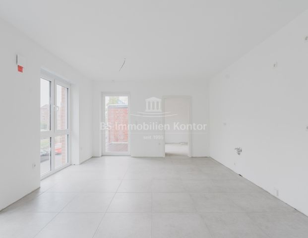 Moderne Obergeschosswohnung mit Balkon – Erstbezug im Stadtkern von Papenburg - Foto 1