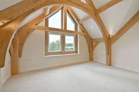 A grand oak-framed country home with vaulted ceilings and striking architectural detail - Photo 4