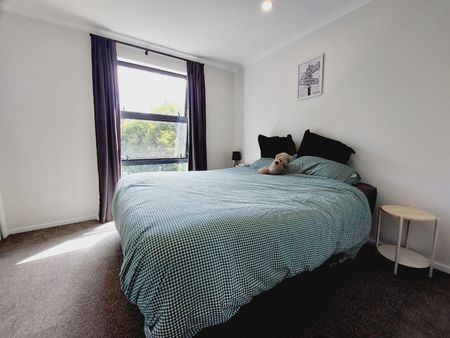 Stylish 2-Bedroom Home with Modern Comforts & Private Outdoor Spaces - Photo 2