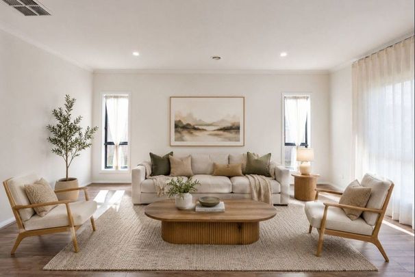 Comfortable Spacious Four-Bedroom Home with Double Garage & Classic Brick Appeal - Photo 1