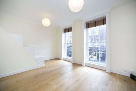A spacious two bedroom split level flat on Exmouth Market - Photo 3