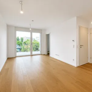 Moderne 2-Zimmer-Neubauwohnung mit Loggia & Parkblick am Laaer Wald - Foto 1