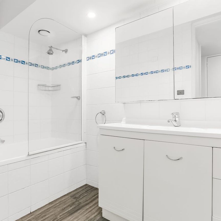 Beautifully Updated & Spacious Split-Level Apartment; Parking & Storage - Deposit Received - Photo 1