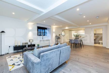 spacious 1 bedroom warehouse conversion with bi folding partition wall - Photo 2