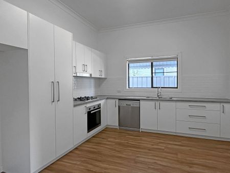 Renovated Three-Bedroom Home Close to the CBD - Photo 3