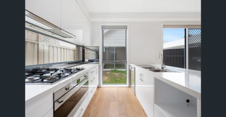 Stylish, Spacious Living with Modern Comfort Across Two Levels - Photo 5