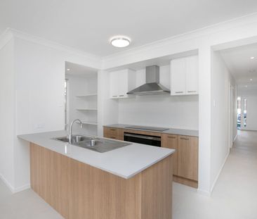 Spacious 4-Bedroom Home in the Heart of Redbank Plains! - Photo 5