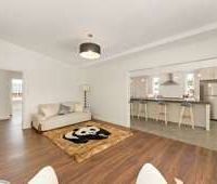 3BR Sun-catcher with great family living areas - Photo 1