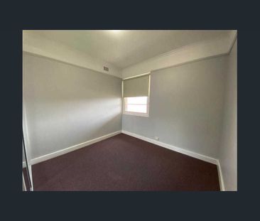 -Centrally located large two bedroom unit with sun room. - Photo 2