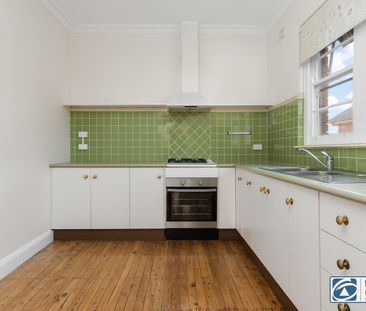 Charming CBD Cottage with Character & Sunlit Living - Photo 5