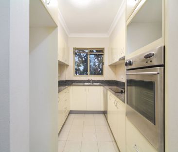 MODERN TWO BEDROOM UNIT IN CONVENIENT LOCATION - Photo 1