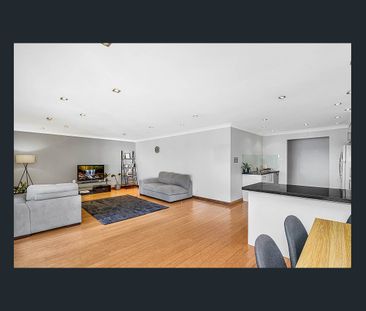 Beautifully Presented, Light Filled Home in a Sought-After Location! - Photo 1