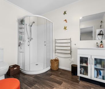 This spacious 4-bedroom, 2-bathroom home is located in the heart of... - Photo 2