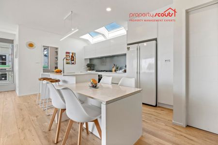 Spacious Designer Home with Flexible Living Across Three Levels - Photo 5