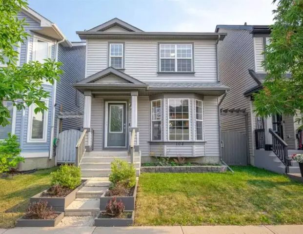 A spacious open-concept home featuring 4 bedrooms, 2 full bathrooms, 2 half bathrooms, and a double garage. | 104 Prestwick Villas Southeast, Calgary - Photo 1