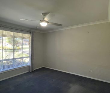 Bright Family Home with Sunroom and Outdoor Living Space - Photo 6