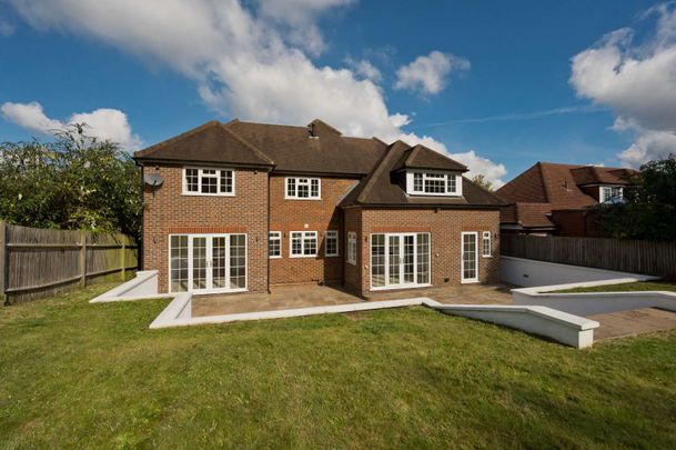 A large five bedroom detached family home with a garage in a very sought after location near Guildford main line station and the the centre of Guildford. - Photo 1