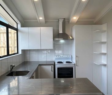 Stylish Renovation with Loads of Parking & West-Facing Deck ! - Photo 3