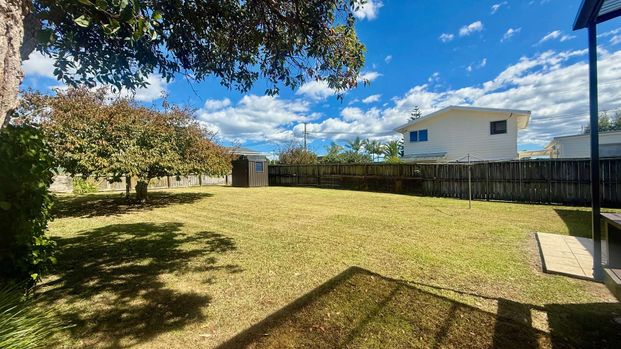 Sunny Two-Bedroom Home with Spacious Backyard - Photo 1