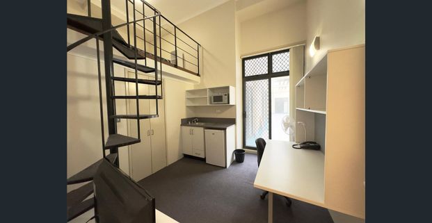 Loft style unit with portable ac - Photo 1